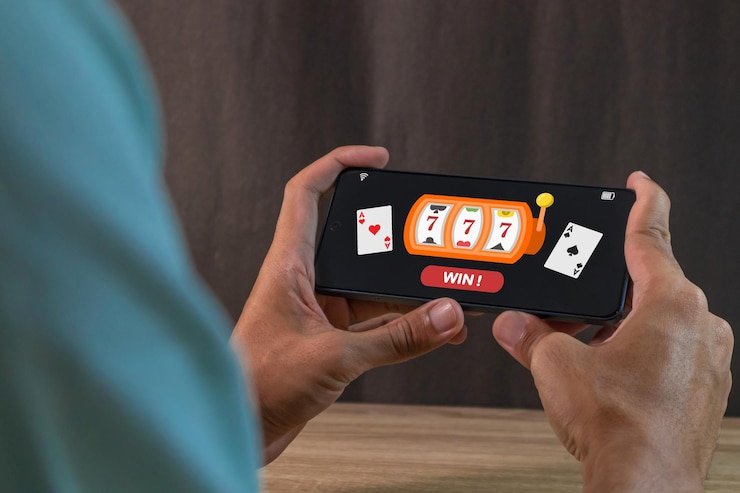 Tampilan antarmuka aplikasi cocbases di ponsel Android menampilkan halaman utama dengan permainan slot dan opsi navigasi